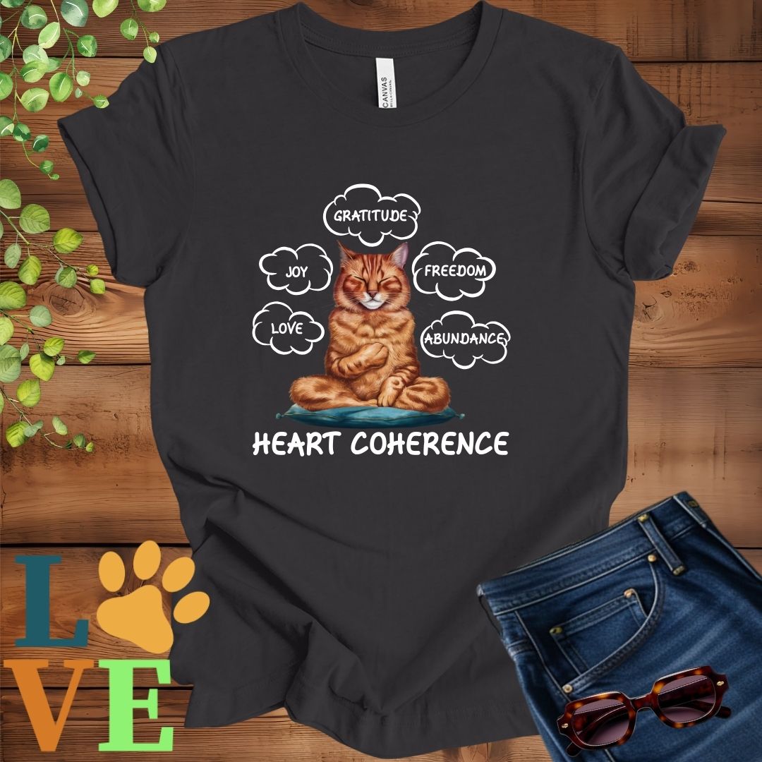 Dark grey heather t-shirt with a meditating Abyssinian cat, surrounded by floating emotion bubbles labelled love, joy, gratitude, freedom, abundance, and 'Heart Coherence' slogan.