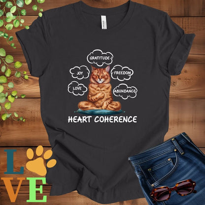 Dark grey heather t-shirt with a meditating Abyssinian cat, surrounded by floating emotion bubbles labelled love, joy, gratitude, freedom, abundance, and 'Heart Coherence' slogan.
