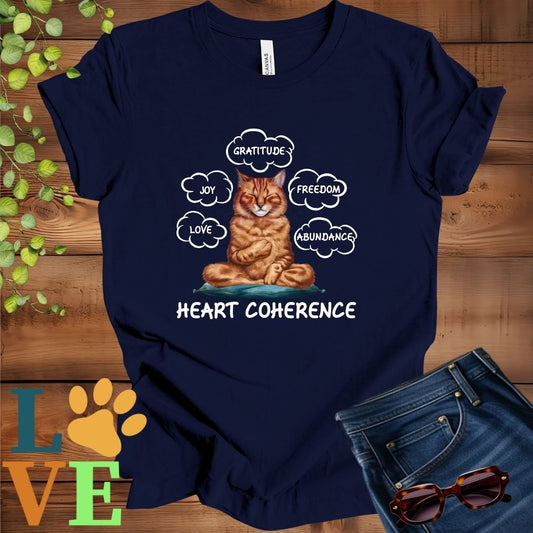 Navy Blue t-shirt with a meditating Abyssinian cat, surrounded by floating emotion bubbles labelled love, joy, gratitude, freedom, abundance, and 'Heart Coherence' slogan.