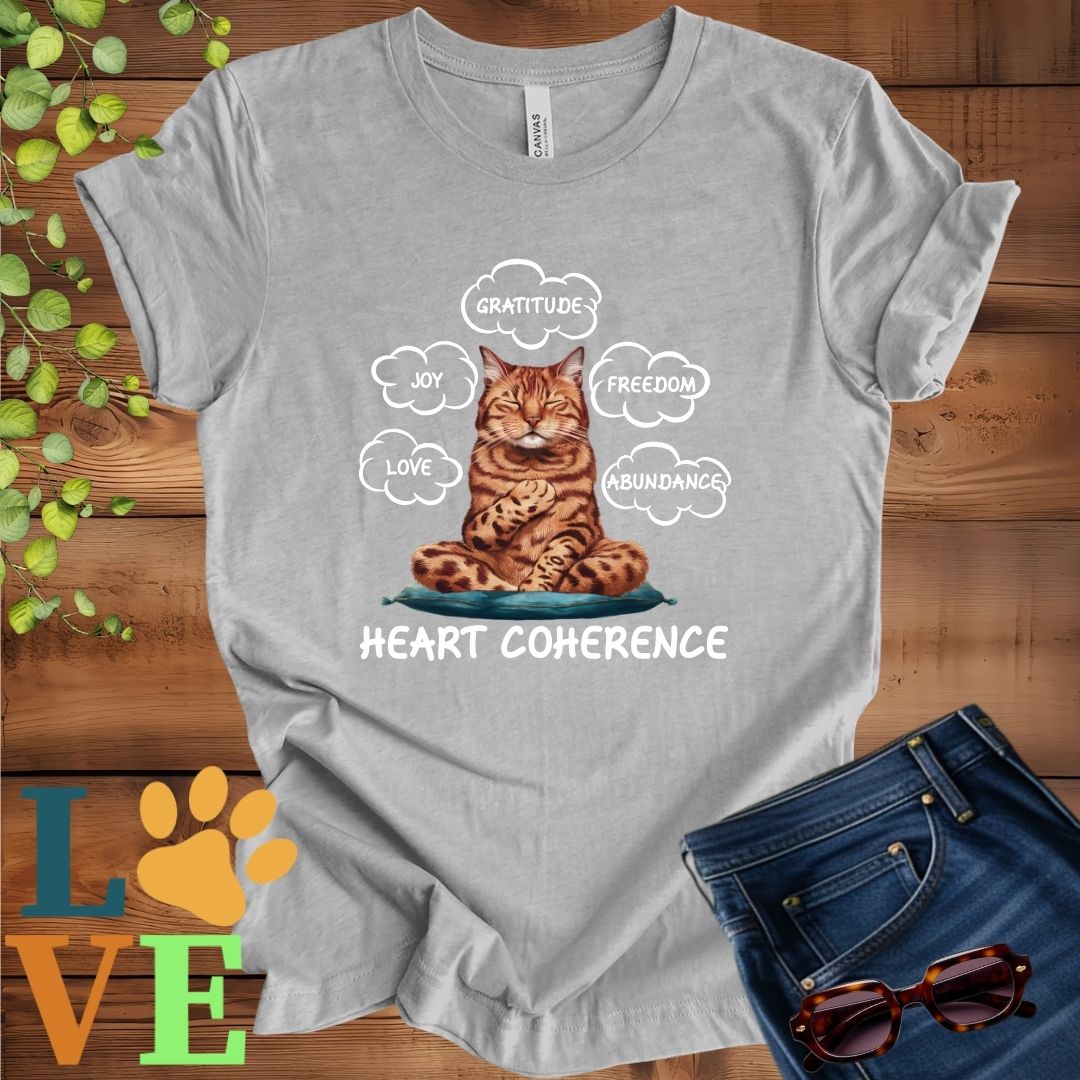 Light grey heather (athletic heather) t-shirt with a meditating Bengal cat, surrounded by floating emotion bubbles labelled love, joy, gratitude, freedom, abundance, and 'Heart Coherence' slogan.