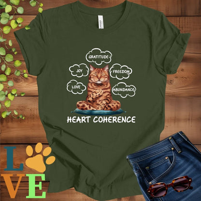 Olive green (military green) t-shirt with a meditating Bengal cat, surrounded by floating emotion bubbles labelled love, joy, gratitude, freedom, abundance, and 'Heart Coherence' slogan.
