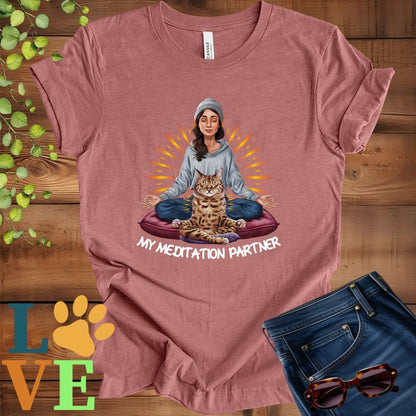 Muted mauve-purple (heather mauve) t-shirt featuring a woman meditating with her Bengal cat and the slogan "My meditation partner".