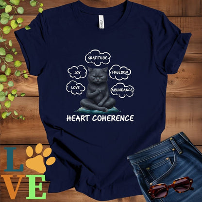 Navy Blue t-shirt with a meditating black cat, surrounded by floating emotion bubbles labelled love, joy, gratitude, freedom, abundance, and 'Heart Coherence' slogan.
