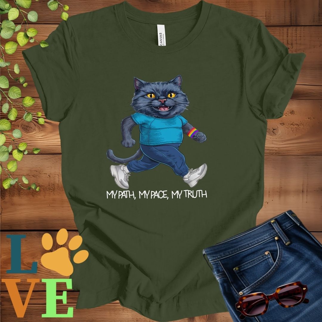 Olive green (military green) t-shirt featuring an anthropomorphic black cat in exercise wear walking confidently with the slogan, "My path, my pace, my truth."
