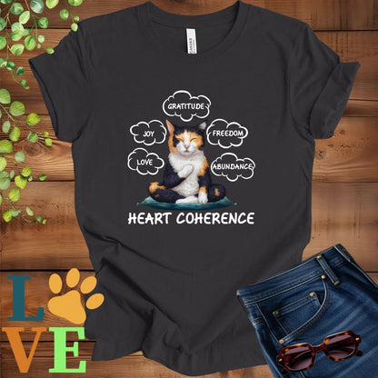 Dark grey heather t-shirt with a meditating calico cat, surrounded by floating emotion bubbles labelled love, joy, gratitude, freedom, abundance, and 'Heart Coherence' slogan.