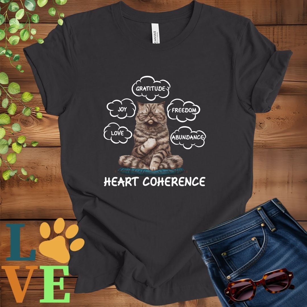 Dark grey heather t-shirt with a meditating Exotic Shorthair cat, surrounded by floating emotion bubbles labelled love, joy, gratitude, freedom, abundance, and 'Heart Coherence' slogan.