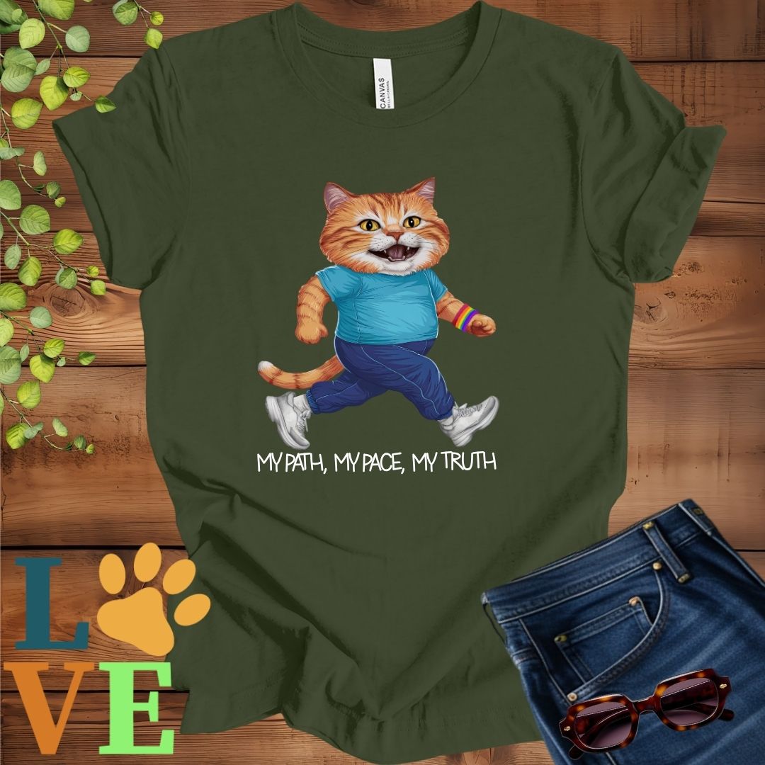Olive green (military green) t-shirt featuring an anthropomorphic ginger cat in exercise wear walking confidently with the slogan, "My path, my pace, my truth."
