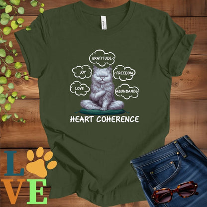 Olive green (military green) t-shirt with a meditating Persian cat, surrounded by floating emotion bubbles labelled love, joy, gratitude, freedom, abundance, and 'Heart Coherence' slogan.
