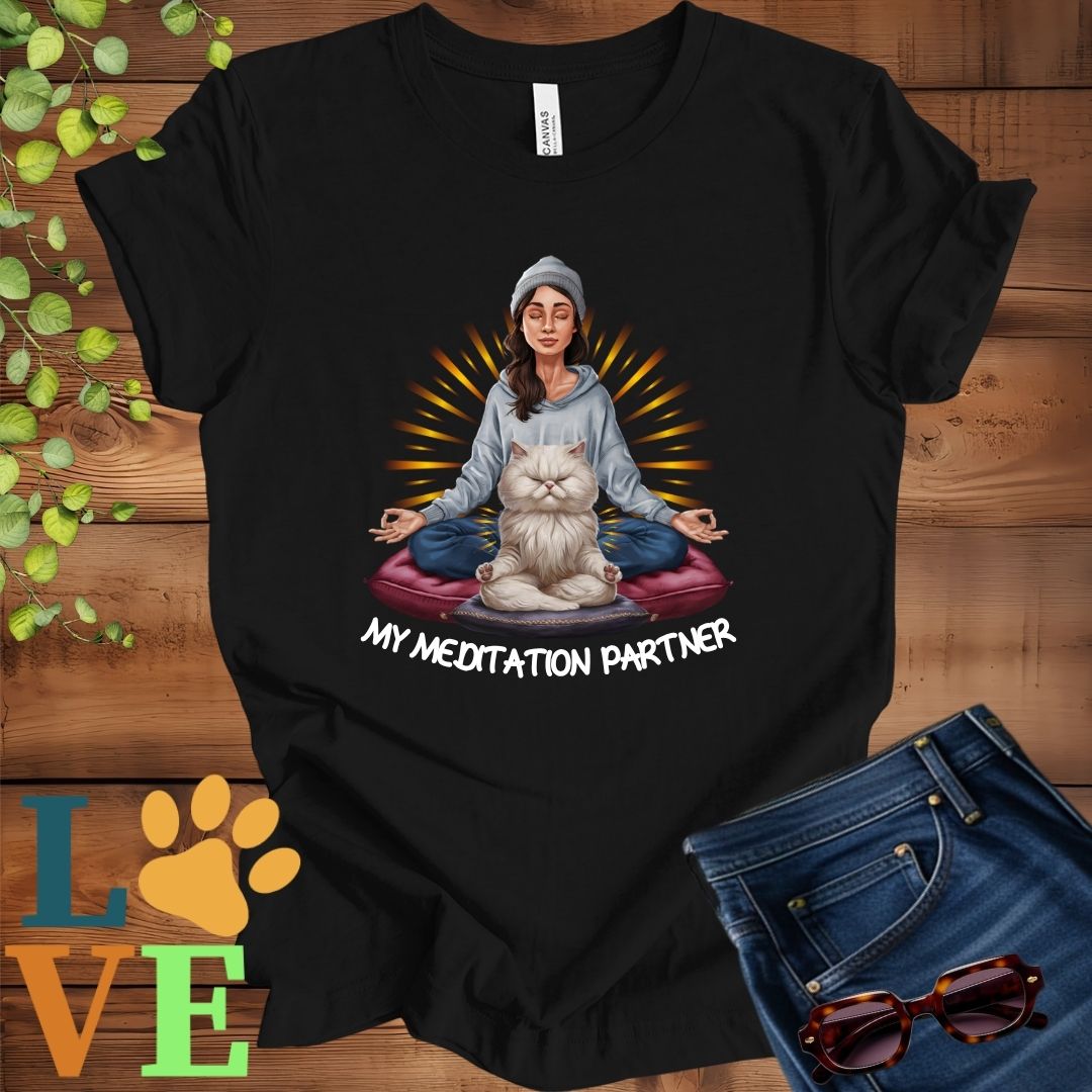 Black t-shirt featuring a woman meditating with her Persian cat and the slogan "My meditation partner".