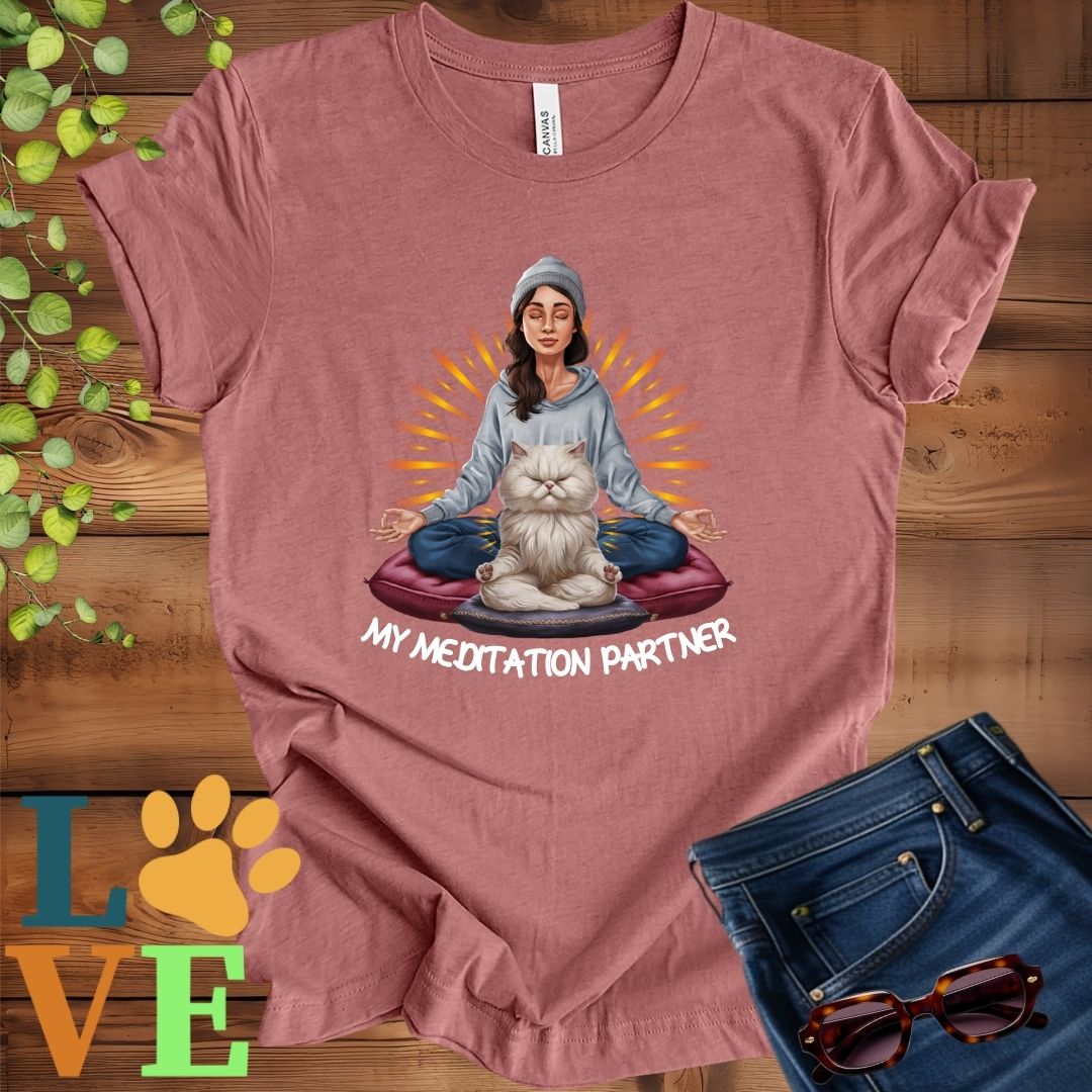 Muted mauve-purple (heather mauve) t-shirt featuring a woman meditating with her Persian cat and the slogan "My meditation partner".