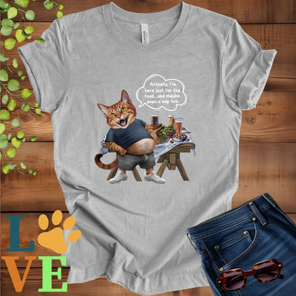 Light grey heather (athletic heather) t-shirt with an anthropomorphic Abyssinian cat, standing in front of a table with food and drinks, showing its pot belly and humorous speech bubble message.