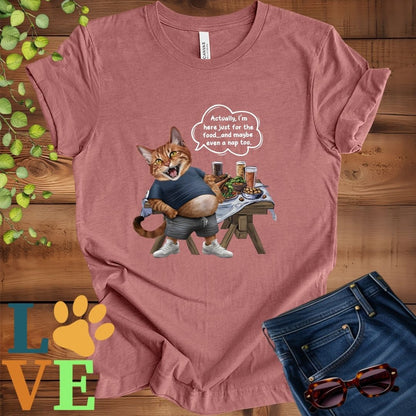 Muted mauve-purple (heather mauve) t-shirt with an anthropomorphic Abyssinian cat,  standing in front of a table with food and drinks, showing its pot belly and humorous speech bubble message.