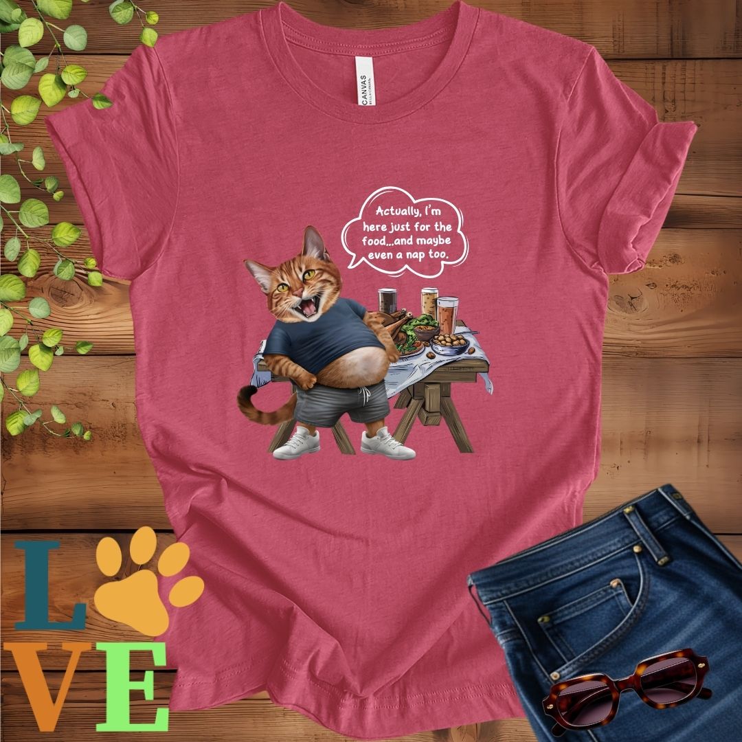 Muted raspberry pink (heather raspberry) t-shirt with an anthropomorphic Abyssinian cat,  standing in front of a table with food and drinks, showing its pot belly and humorous speech bubble message.