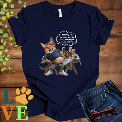Navy blue t-shirt with an anthropomorphic Abyssinian cat,  standing in front of a table with food and drinks, showing its pot belly and humorous speech bubble message.