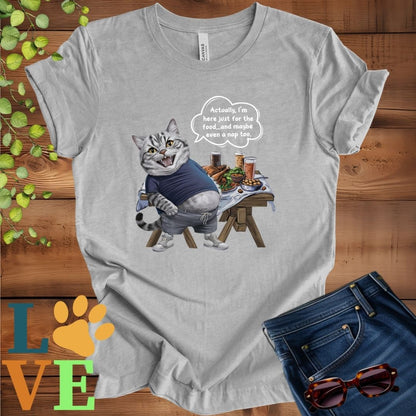 Light grey heather (athletic heather) t-shirt with an anthropomorphic American Shorthair cat, standing in front of a table with food and drinks, showing its pot belly and humorous speech bubble message.
