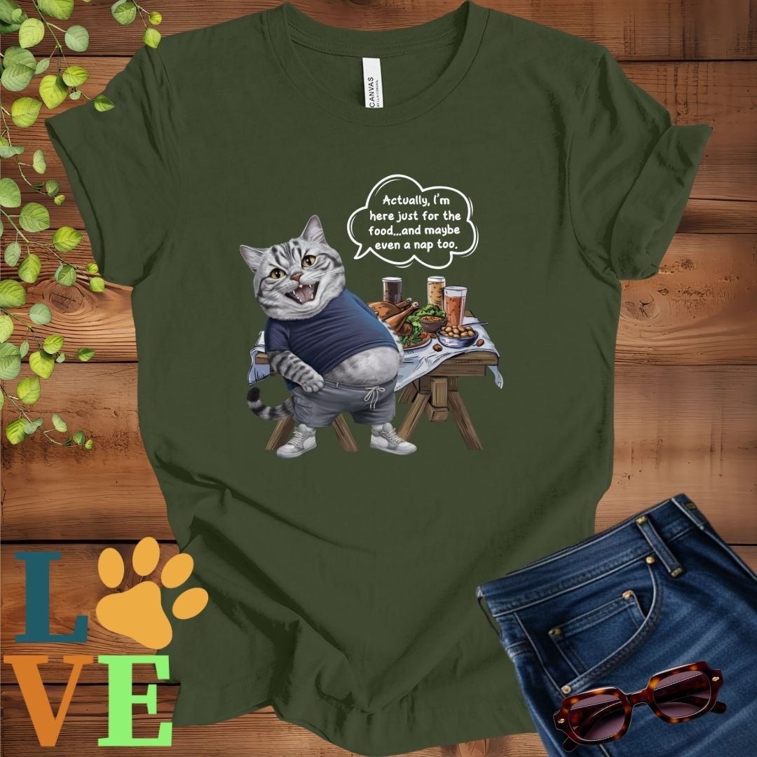 Olive green (military green) t-shirt with an anthropomorphic American Shorthair cat, standing in front of a table with food and drinks, showing its pot belly and humorous speech bubble message.