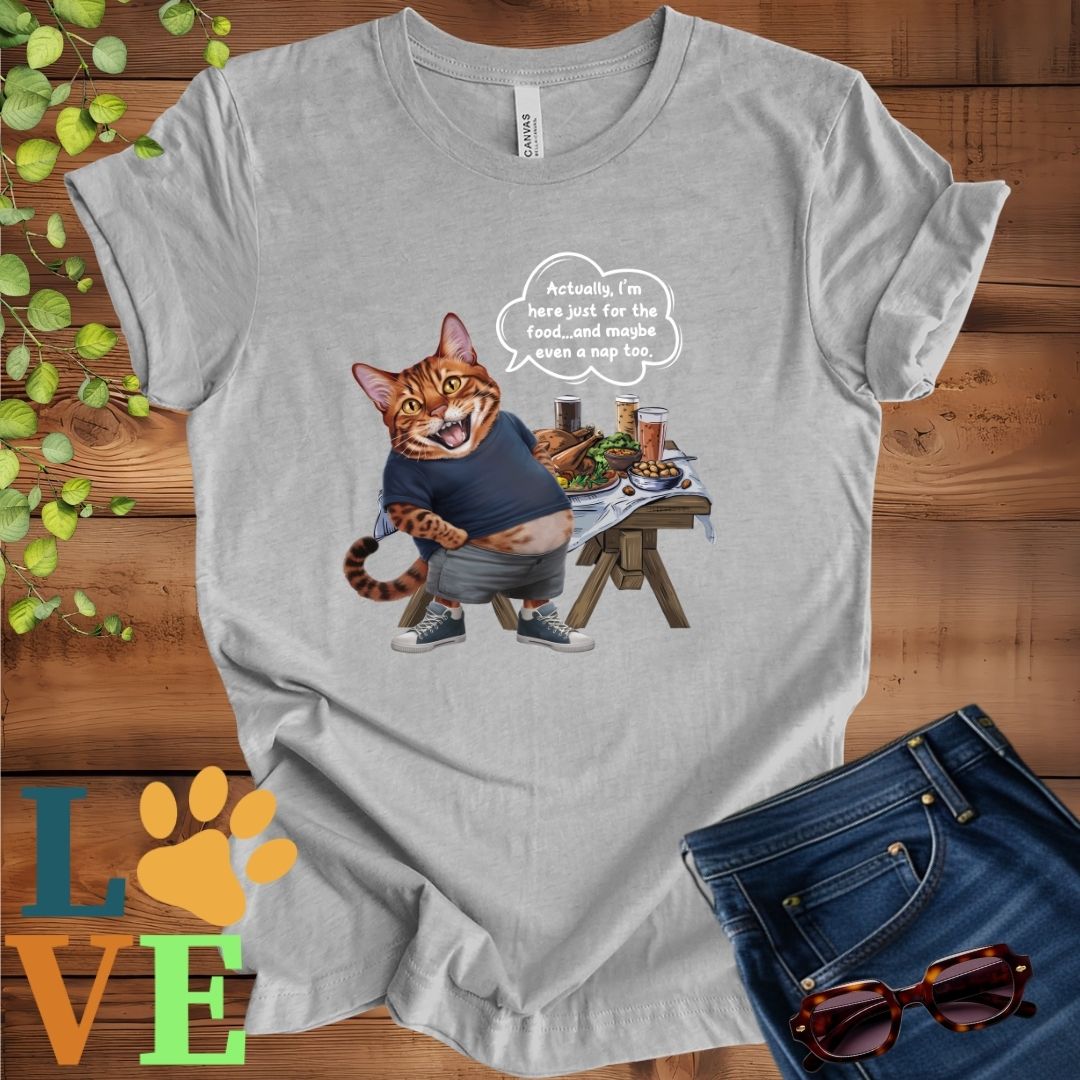 Light grey heather (athletic heather) t-shirt with an anthropomorphic Bengal cat, standing in front of a table with food and drinks, showing its pot belly and humorous speech bubble message.