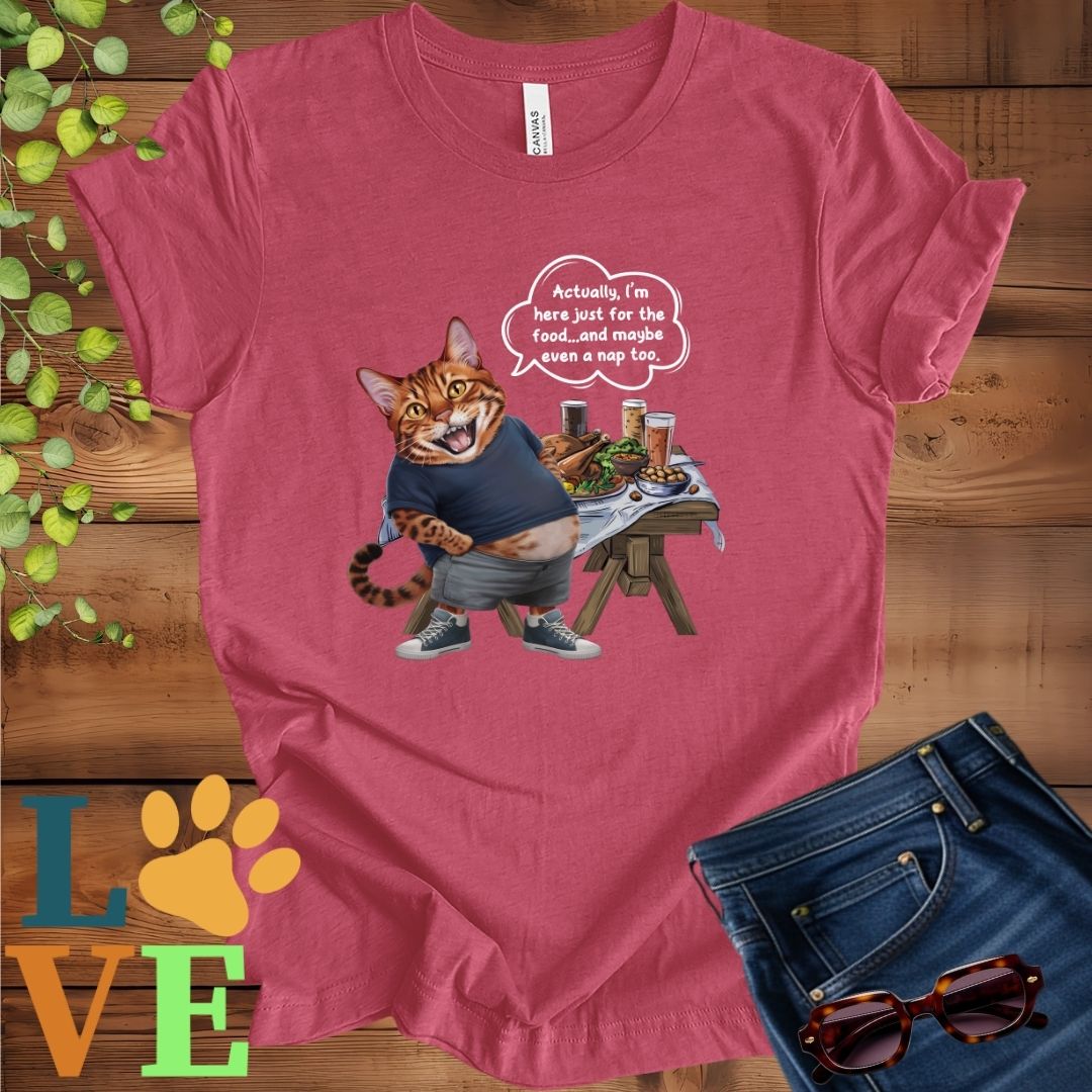Muted raspberry pink (heather raspberry) t-shirt with an anthropomorphic Bengal cat, standing in front of a table with food and drinks, showing its pot belly and humorous speech bubble message.
