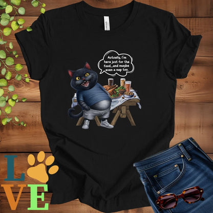 Black t-shirt with an anthropomorphic black cat, standing in front of a table with food and drinks, showing its pot belly and humorous speech bubble message.