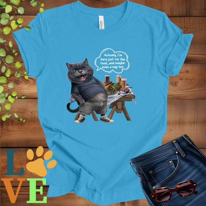 Bright aqua blue t-shirt with an anthropomorphic dark gray British Shorthair cat, standing in front of a table with food and drinks, showing its pot belly and humorous speech bubble message.