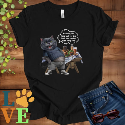 Black t-shirt with an anthropomorphic dark gray British Shorthair cat, standing in front of a table with food and drinks, showing its pot belly and humorous speech bubble message.