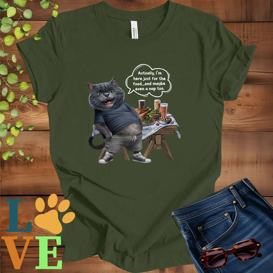 Olive green (military green) t-shirt with an anthropomorphic gray British Shorthair cat, standing in front of a table with food and drinks, showing its pot belly and humorous speech bubble message.