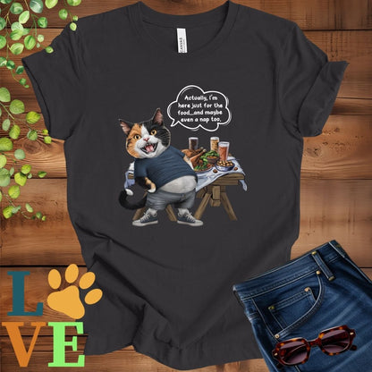 Dark grey heather t-shirt with an anthropomorphic calico cat, standing in front of a table with food and drinks, showing its pot belly and humorous speech bubble message.