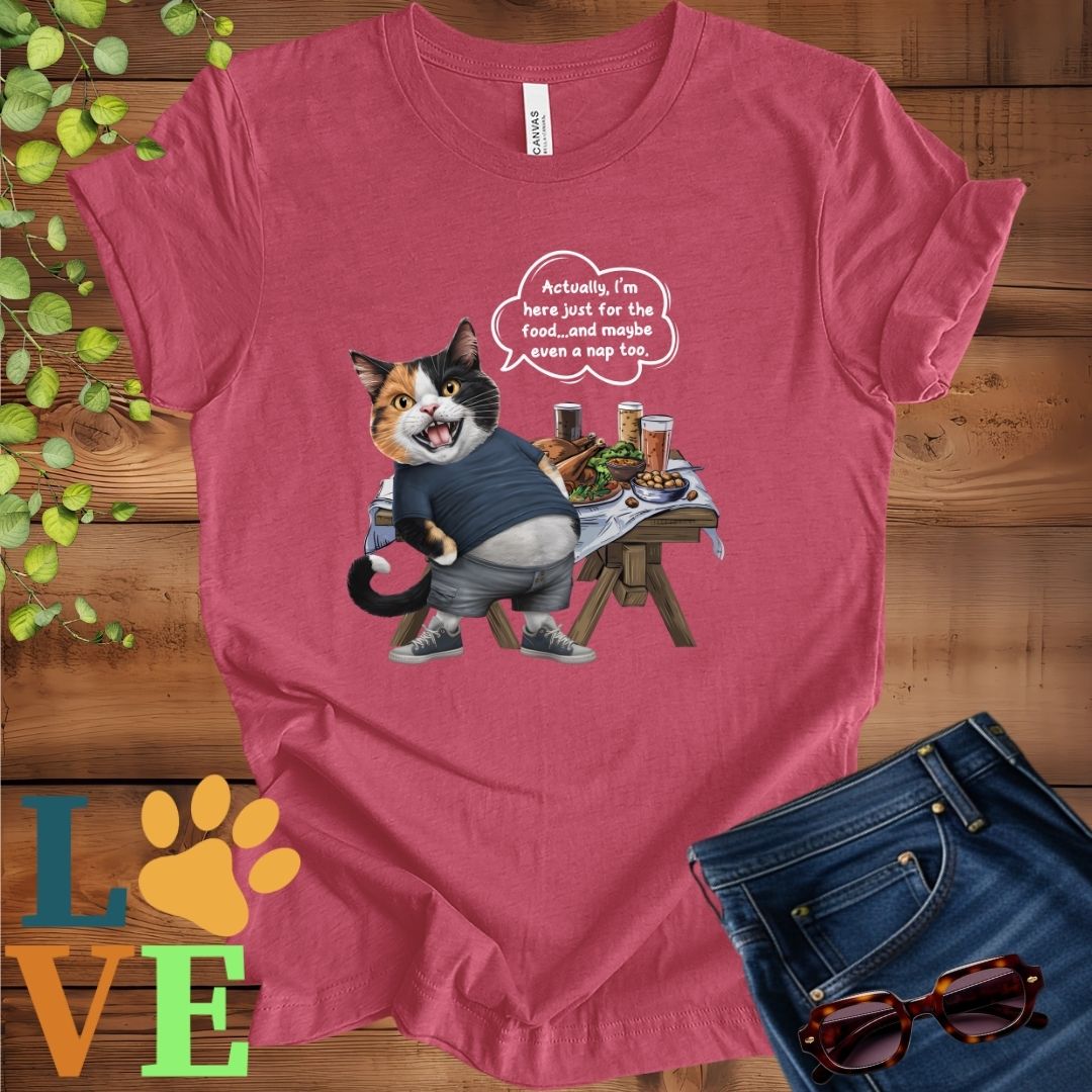 Muted raspberry pink (heather raspberry) t-shirt with an anthropomorphic calico cat, standing in front of a table with food and drinks, showing its pot belly and humorous speech bubble message.