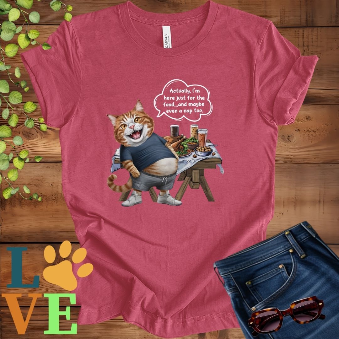 Muted raspberry pink (heather raspberry) t-shirt with an anthropomorphic ginger cat, standing in front of a table with food and drinks, showing its pot belly and humorous speech bubble message.