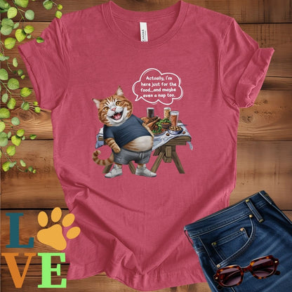 Muted raspberry pink (heather raspberry) t-shirt with an anthropomorphic ginger cat, standing in front of a table with food and drinks, showing its pot belly and humorous speech bubble message.