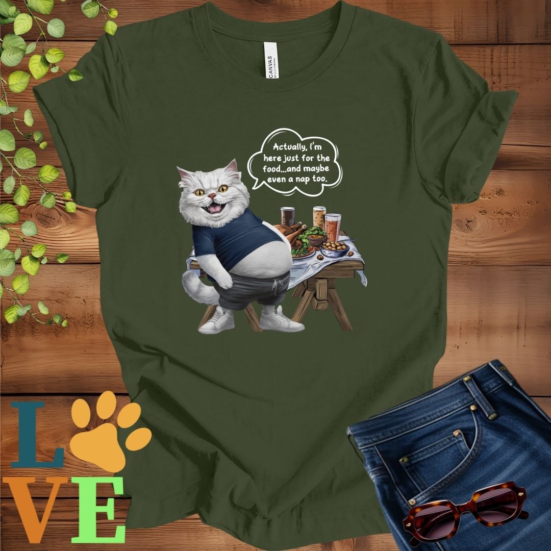 Olive green (military green) t-shirt with an anthropomorphic Persian cat, standing in front of a table with food and drinks, showing its pot belly and humorous speech bubble message.