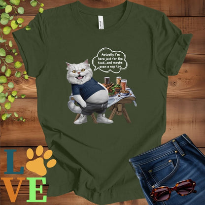 Olive green (military green) t-shirt with an anthropomorphic Persian cat, standing in front of a table with food and drinks, showing its pot belly and humorous speech bubble message.