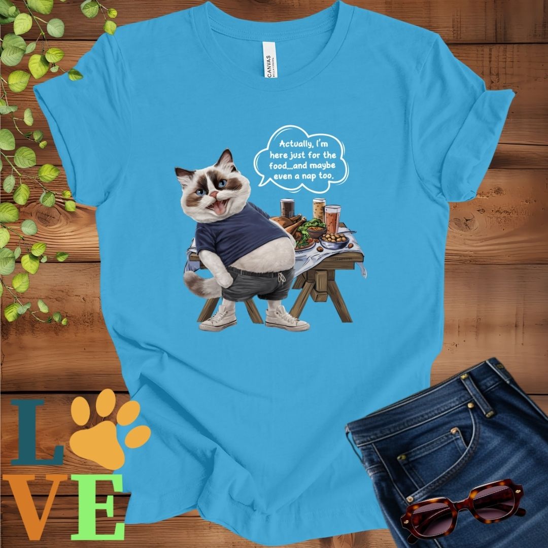Bright aqua blue t-shirt with an anthropomorphic Ragdoll cat, standing in front of a table with food and drinks, showing its pot belly and humorous speech bubble message.