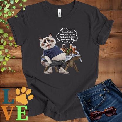 Dark grey heather t-shirt with an anthropomorphic Ragdoll cat, standing in front of a table with food and drinks, showing its pot belly and humorous speech bubble message.