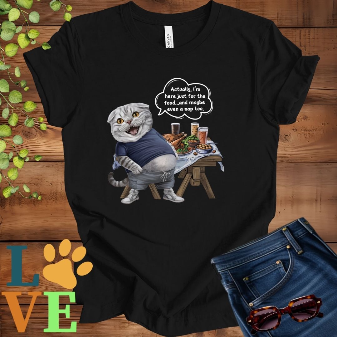 Black t-shirt with an anthropomorphic Scottish Fold cat, standing in front of a table with food and drinks, showing its pot belly and humorous speech bubble message.