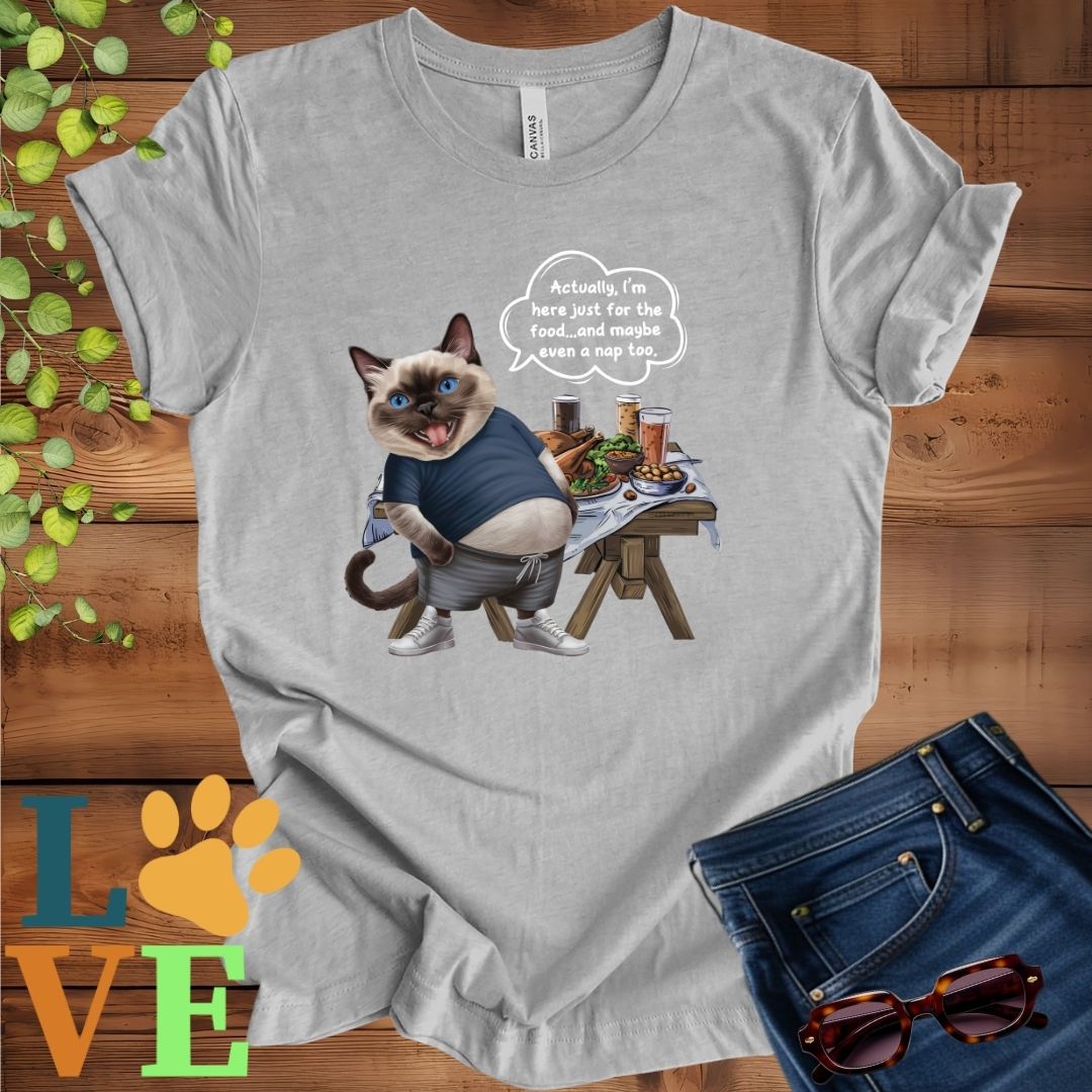 Light grey heather (athletic heather) t-shirt with an anthropomorphic Siamese cat, standing in front of a table with food and drinks, showing its pot belly and humorous speech bubble message.