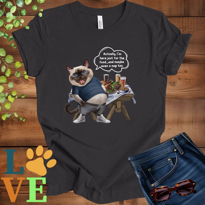 Dark grey heather t-shirt with an anthropomorphic Siamese cat, standing in front of a table with food and drinks, showing its pot belly and humorous speech bubble message.