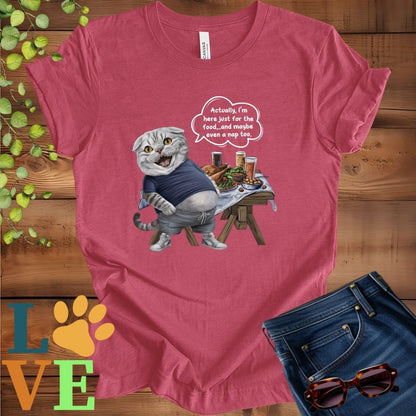 Muted raspberry pink (heather raspberry) t-shirt with an anthropomorphic Scottish Fold cat, standing in front of a table with food and drinks, showing its pot belly and humorous speech bubble message.
