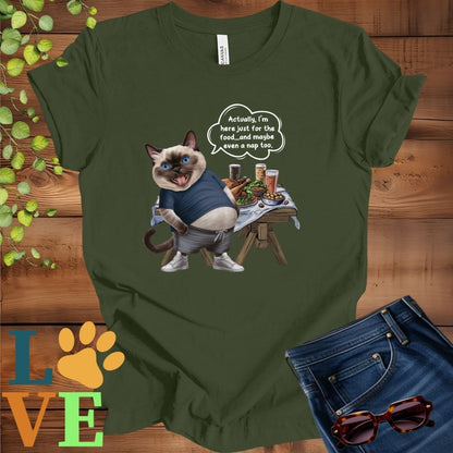 Olive green (military green) t-shirt with an anthropomorphic Siamese cat, standing in front of a table with food and drinks, showing its pot belly and humorous speech bubble message.