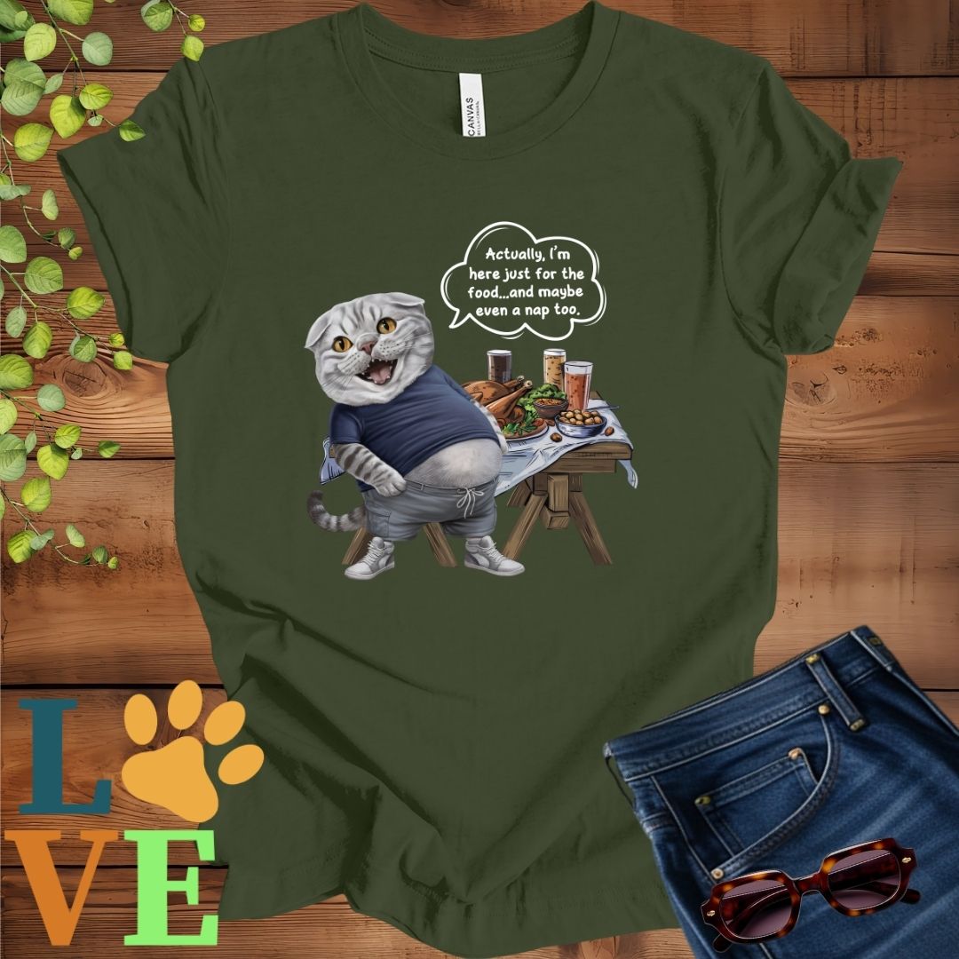 Olive green (military green) t-shirt with an anthropomorphic Scottish Fold cat, standing in front of a table with food and drinks, showing its pot belly and humorous speech bubble message.