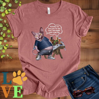 Muted mauve-purple (heather mauve) t-shirt with an anthropomorphic Sphynx cat, standing in front of a table with food and drinks, showing its pot belly and humorous speech bubble message.