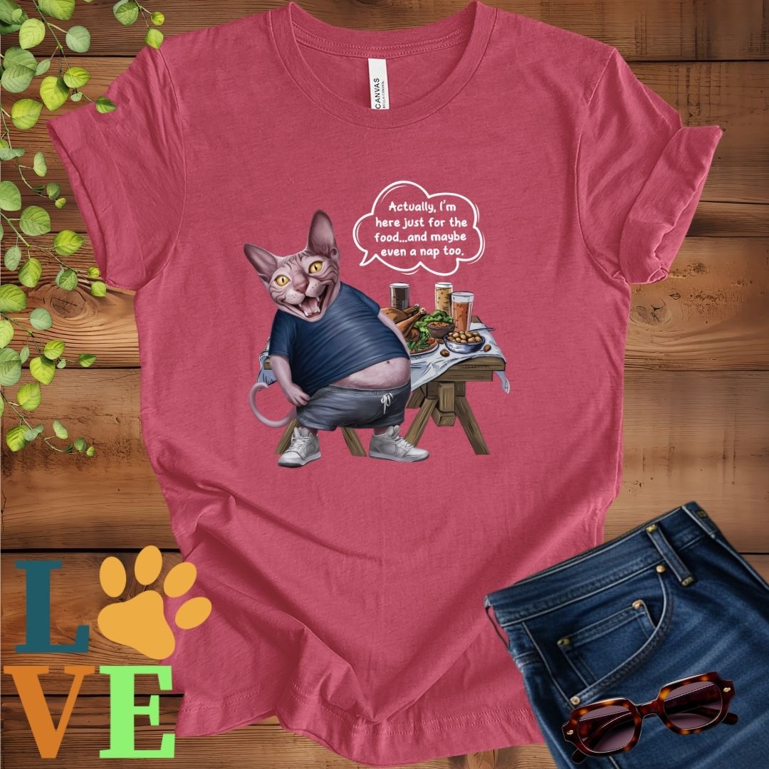 Muted raspberry pink (heather raspberry) t-shirt with an anthropomorphic Sphynx cat, standing in front of a table with food and drinks, showing its pot belly and humorous speech bubble message.