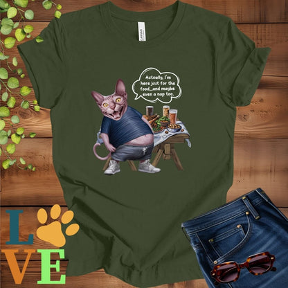Olive green (military green) t-shirt with an anthropomorphic Sphynx cat, standing in front of a table with food and drinks, showing its pot belly and humorous speech bubble message.