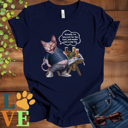 Navy blue t-shirt with an anthropomorphic Sphynx cat, standing in front of a table with food and drinks, showing its pot belly and humorous speech bubble message.
