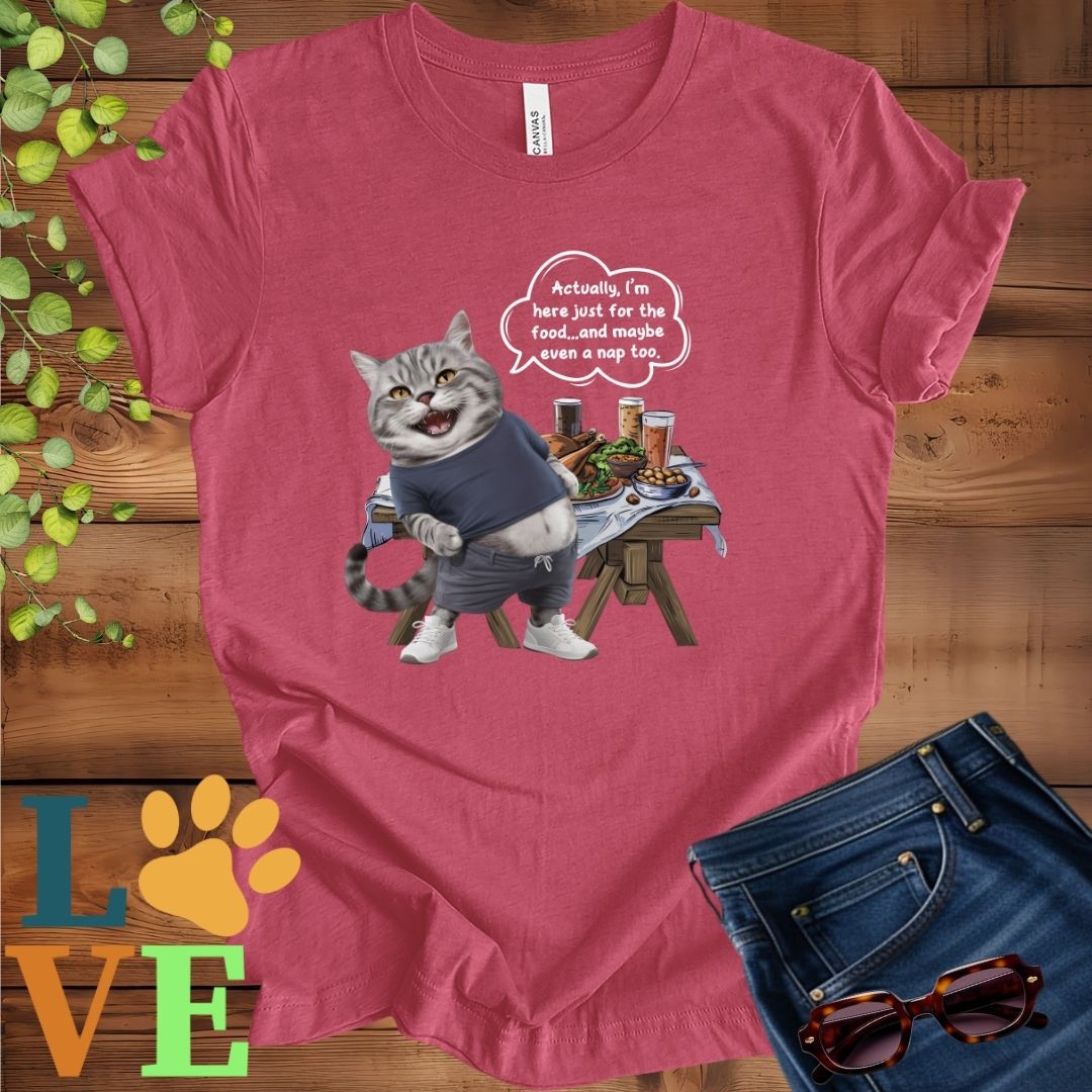 Muted raspberry pink (heather raspberry) t-shirt with an anthropomorphic tabby cat, standing in front of a table with food and drinks, showing its pot belly and humorous speech bubble message.