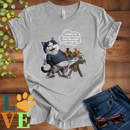 Light grey heather (athletic heather) t-shirt with an anthropomorphic tuxedo cat, standing in front of a table with food and drinks, showing its pot belly and humorous speech bubble message.