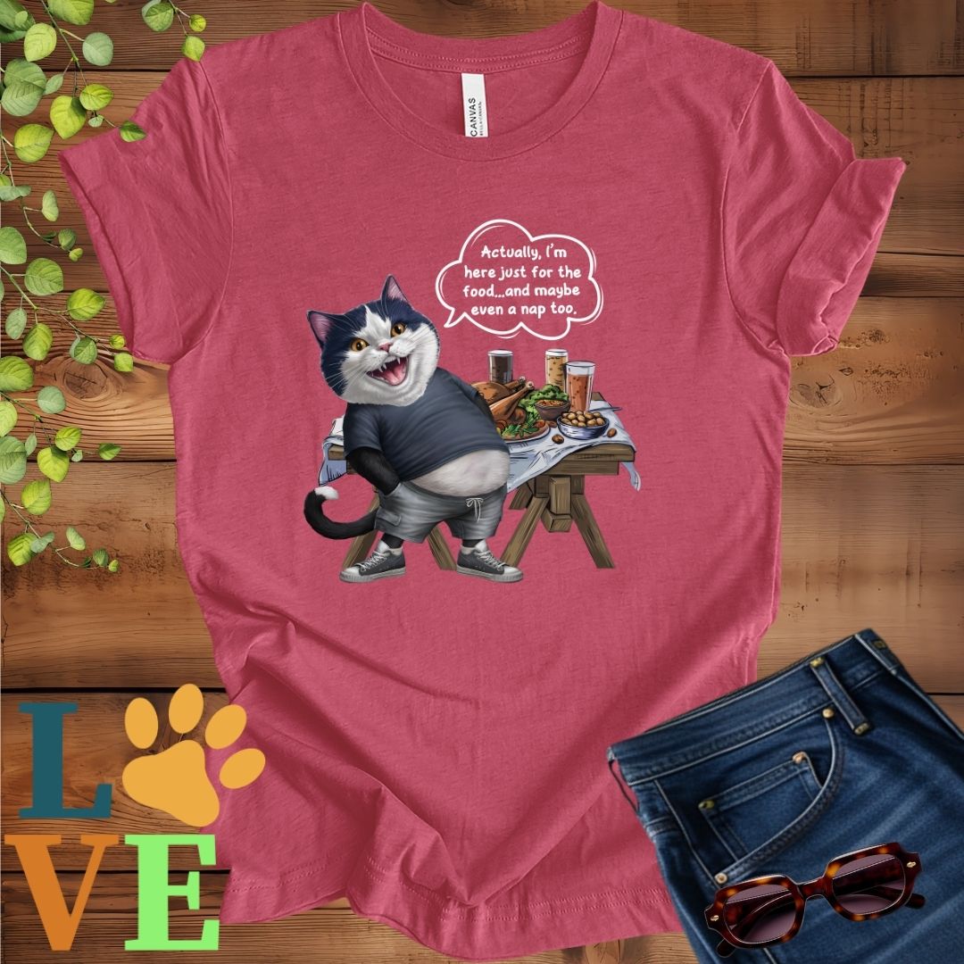 Muted raspberry pink (heather raspberry) t-shirt with an anthropomorphic tuxedo cat, standing in front of a table with food and drinks, showing its pot belly and humorous speech bubble message.
