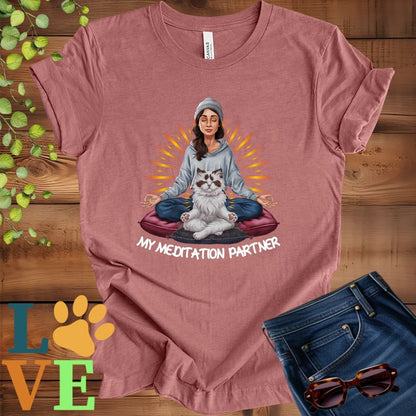 Muted mauve-purple (heather mauve) t-shirt featuring a woman meditating with her Ragdoll cat and the slogan "My meditation partner".
