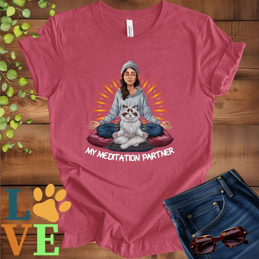 Muted raspberry pink (heather raspberry) t-shirt featuring a woman meditating with her Ragdoll cat and the slogan "My meditation partner".