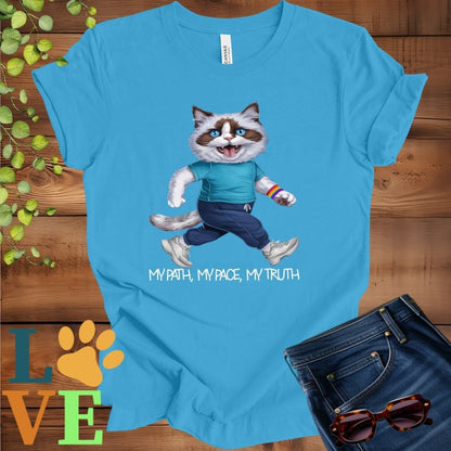 Bright aqua blue t-shirt featuring an anthropomorphic Ragdoll cat in exercise wear walking confidently with the slogan, "My path, my pace, my truth."
